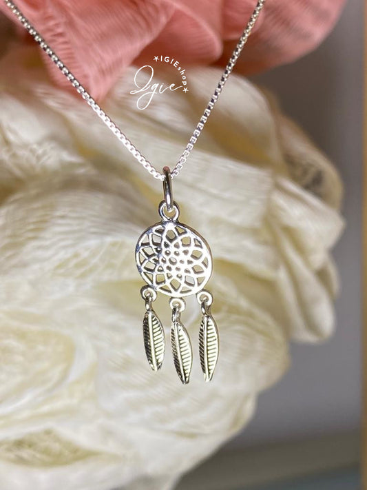 Silver necklace charm